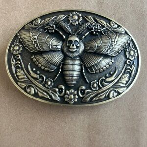 Vintage Style Skull Moth Belt Buckle In An Ancient Gold Finish.